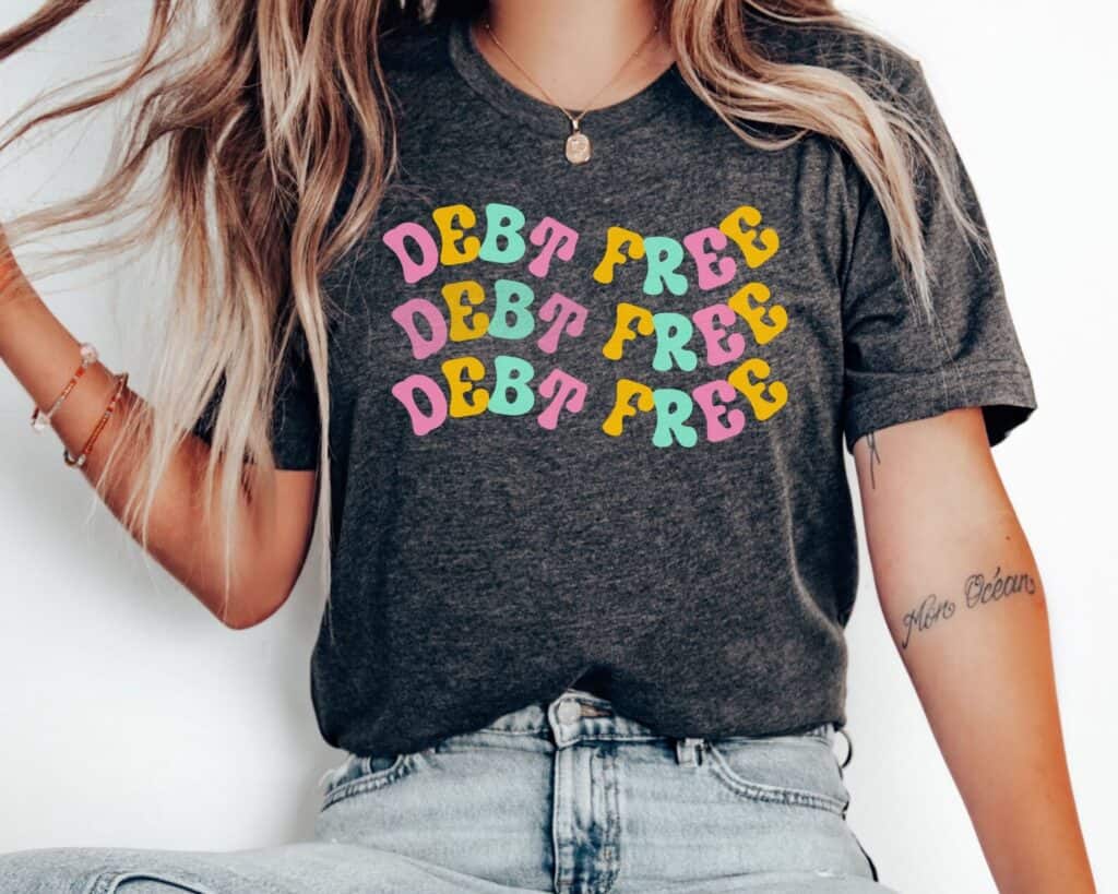 A woman wearing a debt free t-shirt