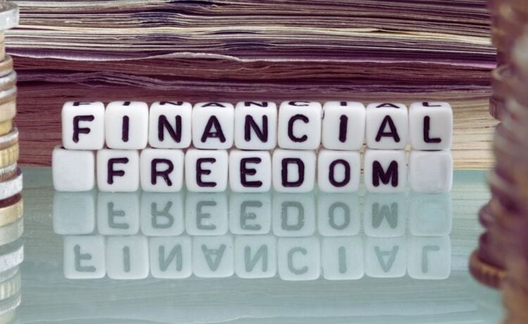 Financial freedom spelled out with blocks surrounded by money